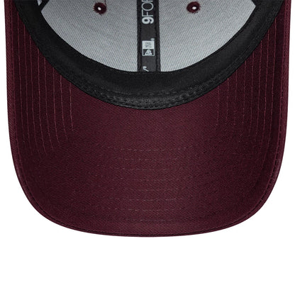 Womens Lacoste X New Era Dark Purple 9FORTY Adjustable Cap, inside view revealing the structured black sweatband, grey internal taping with 9FORTY branding, and a maroon undervisor with stitch lines across the curved edge.