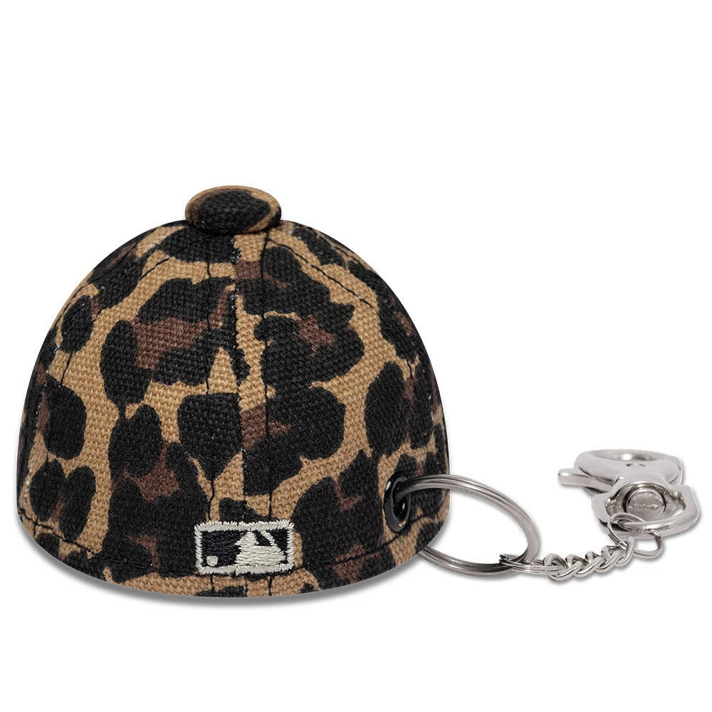New Era New York Yankees MLB Leo Mini Cap Black Key Chain, rear view showing a black and brown leopard print pattern with the MLB Batterman logo embroidered at the centre back, attached to a silver key chain and clasp.