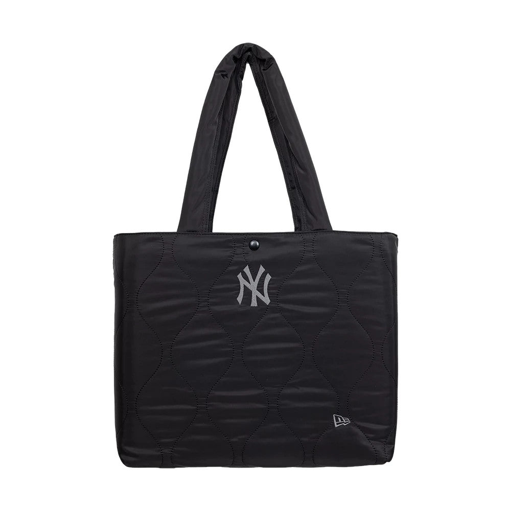 New Era New York Yankees MLB Black Padded Tote Bag, front view showing a quilted black design with a silver embroidered Yankees logo centred on the upper section, a button closure, and a small embroidered New Era logo near the bottom corner.