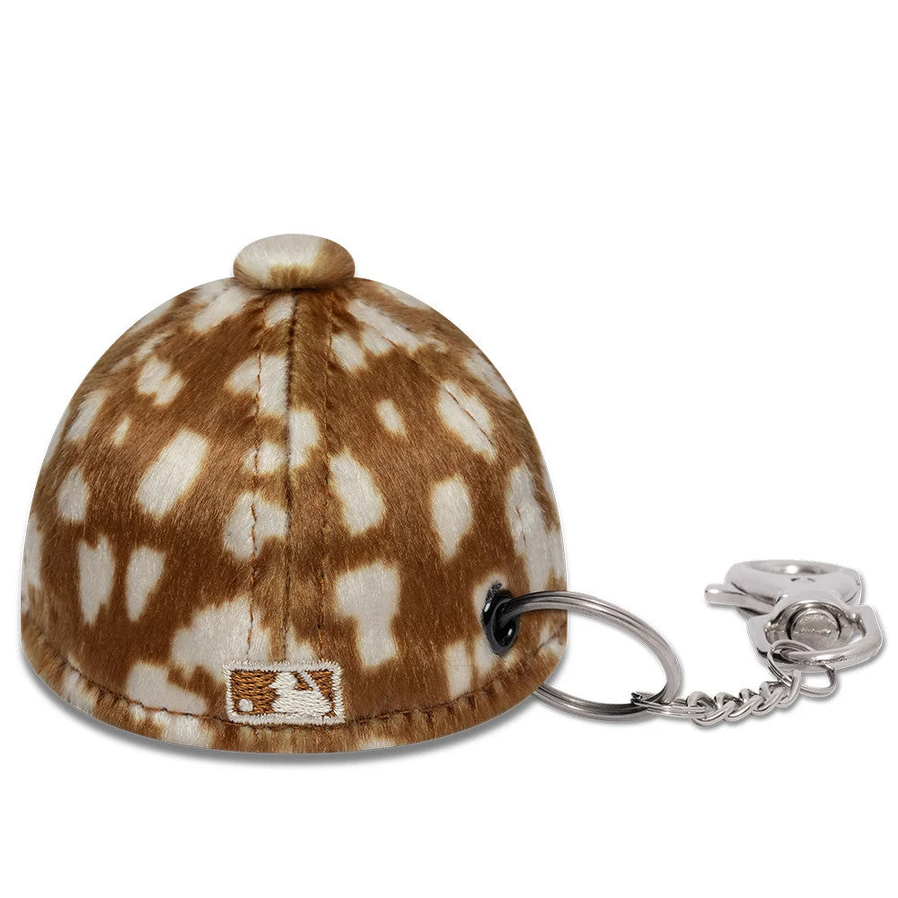 New Era New York Yankees MLB Animal Mini Cap Light Brown Key Chain, rear view showing an embroidered MLB Batterman logo at the base of the speckled brown and white mini cap body, with a key ring attached on the side.