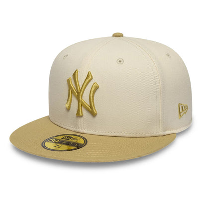 Pictured is this MLB League Essential New York Yankees 59FIFTY Fitted cap in cream & gold. 1