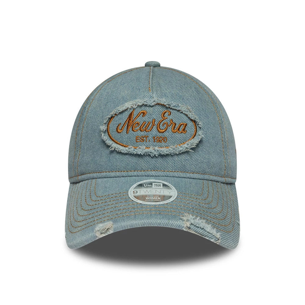 Womens New Era Distress Pastel Blue 9TWENTY A-Frame Adjustable Cap, front view showing a tan embroidered New Era logo with distressed edges on the denim-style crown, with a matching visor and a 9TWENTY size sticker in the centre.