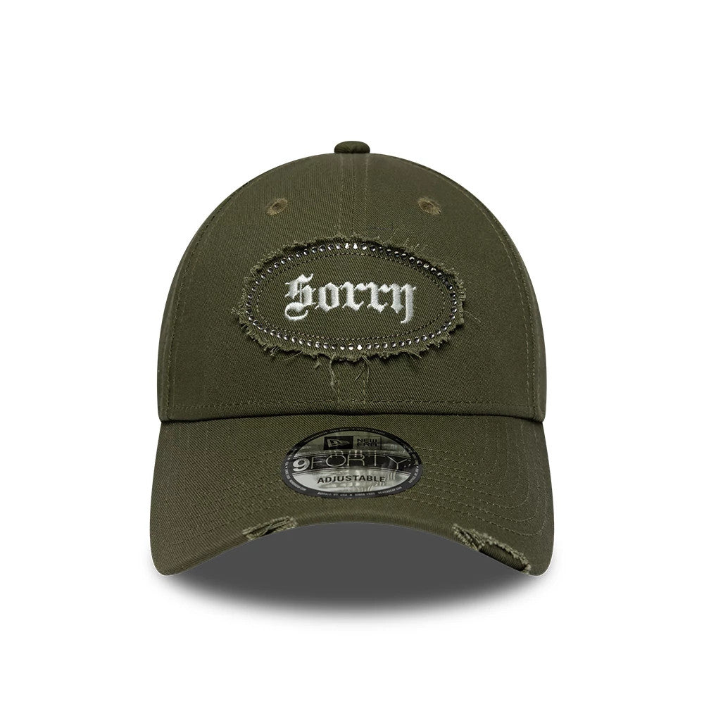 New Era Gem Patch Distress Green 9FORTY Adjustable Cap, front view showing a Sorry patch with frayed edges and rhinestone border on the structured green crown, complemented by a matching curved visor and clear 9FORTY size sticker.