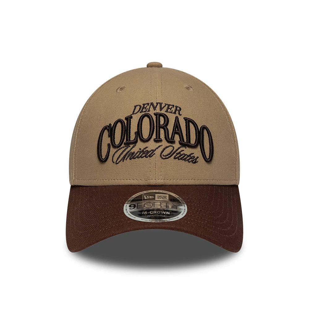 New Era Colorado Beige & Brown 9FORTY M-Crown Adjustable Cap, front view showing the raised black embroidered Denver Colorado United States lettering on the beige crown, with a contrasting dark brown curved visor featuring a 9FORTY size sticker.