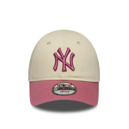 Pictured is this Toddler MLB League Essential New York Yankees 9FORTY cap in light beige & pink. 2