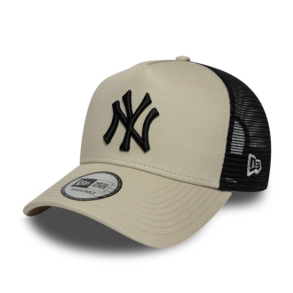 Pictured is this MLB League Essential New York Yankees 9FORTY A-Frame Trucker cap in light beige. 1