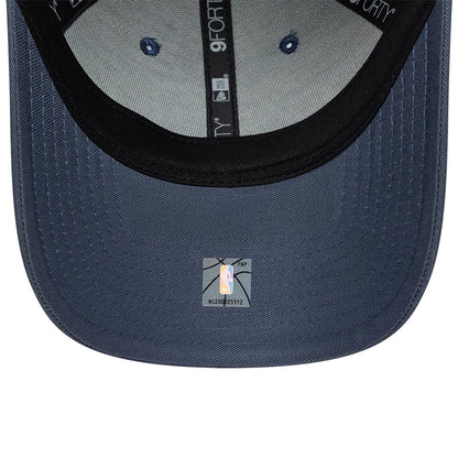 LA Lakers NBA Team Outline Dark Blue New Era 9FORTY Adjustable Cap, inside view showing grey taping with 9FORTY branding, a black sweatband lining the crown, and a grey undervisor featuring an NBA holographic sticker at the centre.