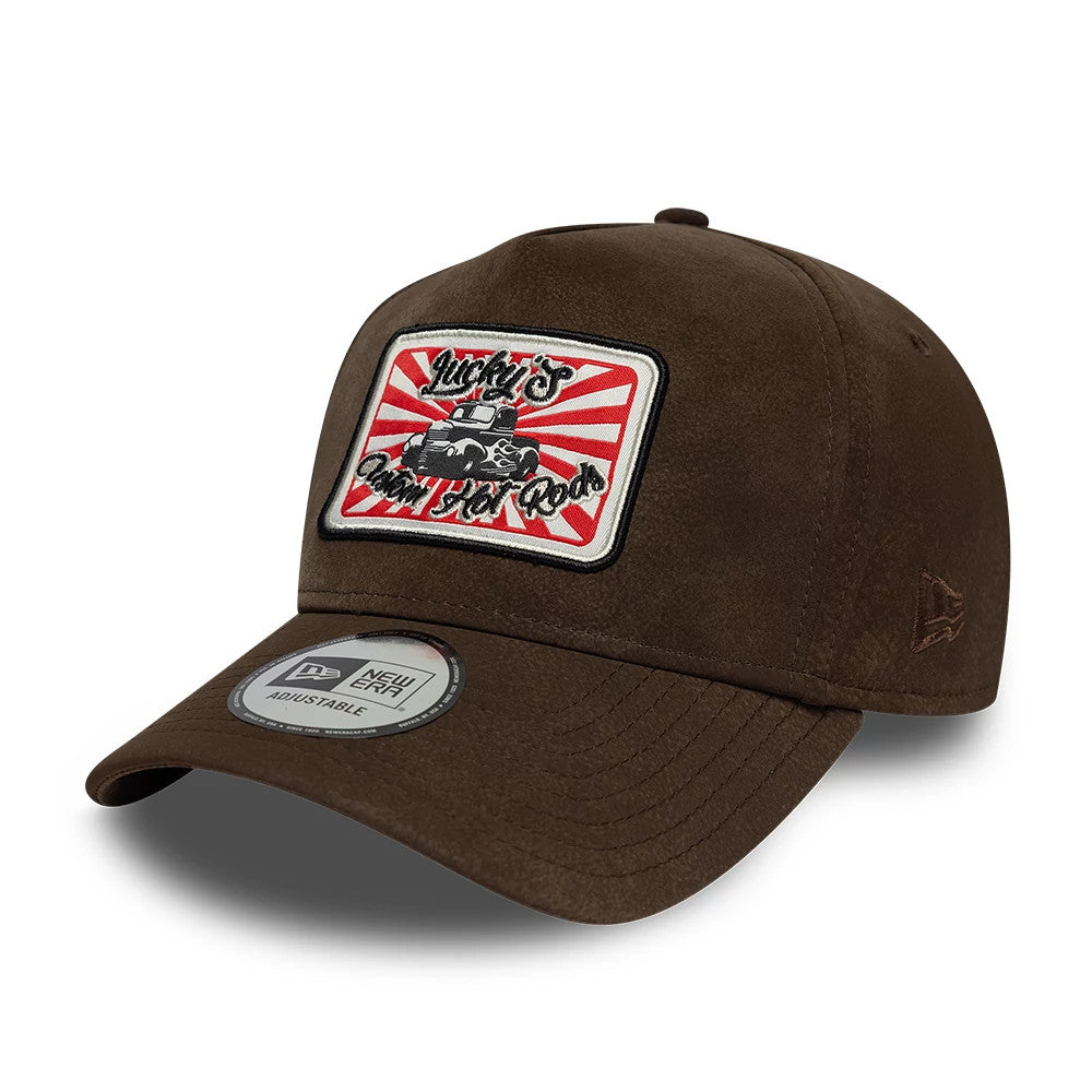 Pictured is this New Era Moto Patch PU 9FORTY E-Frame cap in brown. 1