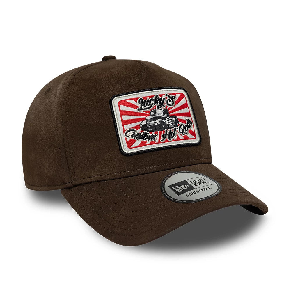 Pictured is this New Era Moto Patch PU 9FORTY E-Frame cap in brown. 3