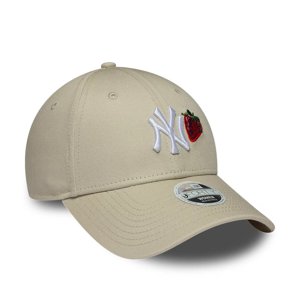New York Yankees Womens MLB Fruit Icon Light Beige New Era 9FORTY Adjustable Cap, front view showing the white raised embroidered NY logo beside a red strawberry graphic on the front panel, with a beige curved visor and 9FORTY size sticker.