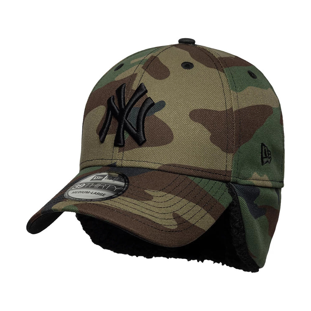 New York Yankees MLB Camo Black New Era 39THIRTY Downflap Stretch Fit Cap, three-quarter view showing the black embroidered NY logo on the front camo panel, curved visor with 39THIRTY size sticker, and black New Era flag logo on the left side.