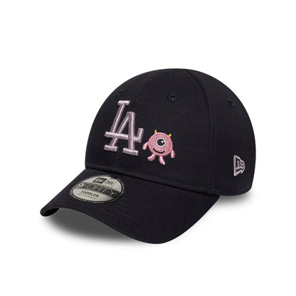 LA Dodgers Toddler MLB Monster Icon Navy New Era 9FORTY Adjustable Cap, front view showing silver LA embroidery with a pink monster icon on the front panel, a curved navy visor, and a 9FORTY size sticker.