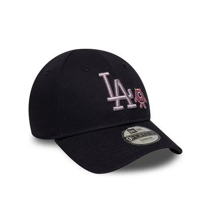 LA Dodgers Toddler MLB Monster Icon Navy New Era 9FORTY Adjustable Cap, front view showing the pink embroidered LA logo alongside a small monster icon, with a pre-curved navy visor and a 9FORTY size sticker on the visor.