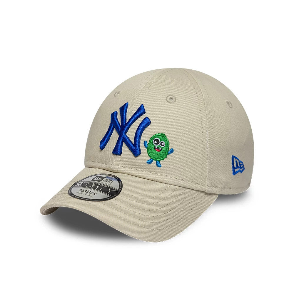 Yankees Toddler MLB Monster Icon Beige New Era 9FORTY Adjustable Cap, three-quarter view showing the blue embroidered NY logo and a green monster graphic on the structured beige crown, with a grey 9FORTY size sticker on the curved visor.