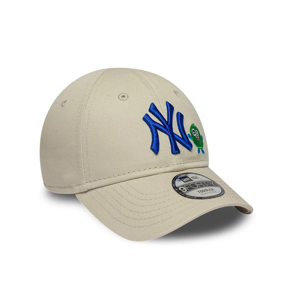 Yankees Toddler MLB Monster Icon Beige New Era 9FORTY Adjustable Cap, three-quarter view showing the blue NY logo with embroidered green monster icon on the front panel, curved beige visor, and 9FORTY size sticker on the visor.