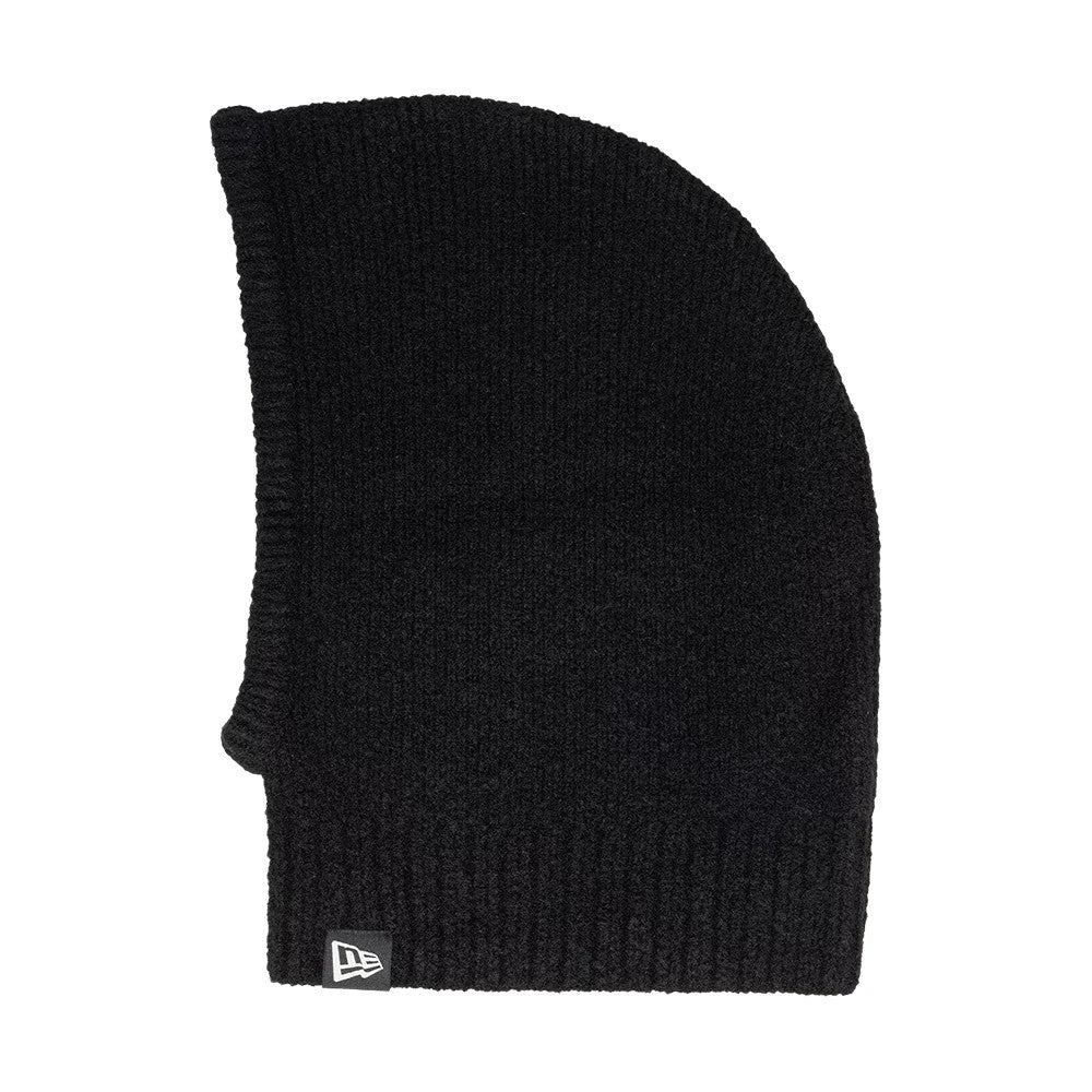New Era Slouch Black Balaclava Hat, side view showing the knitted black fabric with a ribbed texture, extended neck coverage, and the New Era flag logo in white placed at the bottom edge.