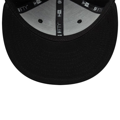 Youth Teenage Mutant Ninja Turtles Black New Era 9FIFTY Snapback Adjustable Cap, inside view showing grey undervisor, black taping with repeated 9FIFTY branding, and a black sweatband contrasting with grey fabric lining the structured crown.