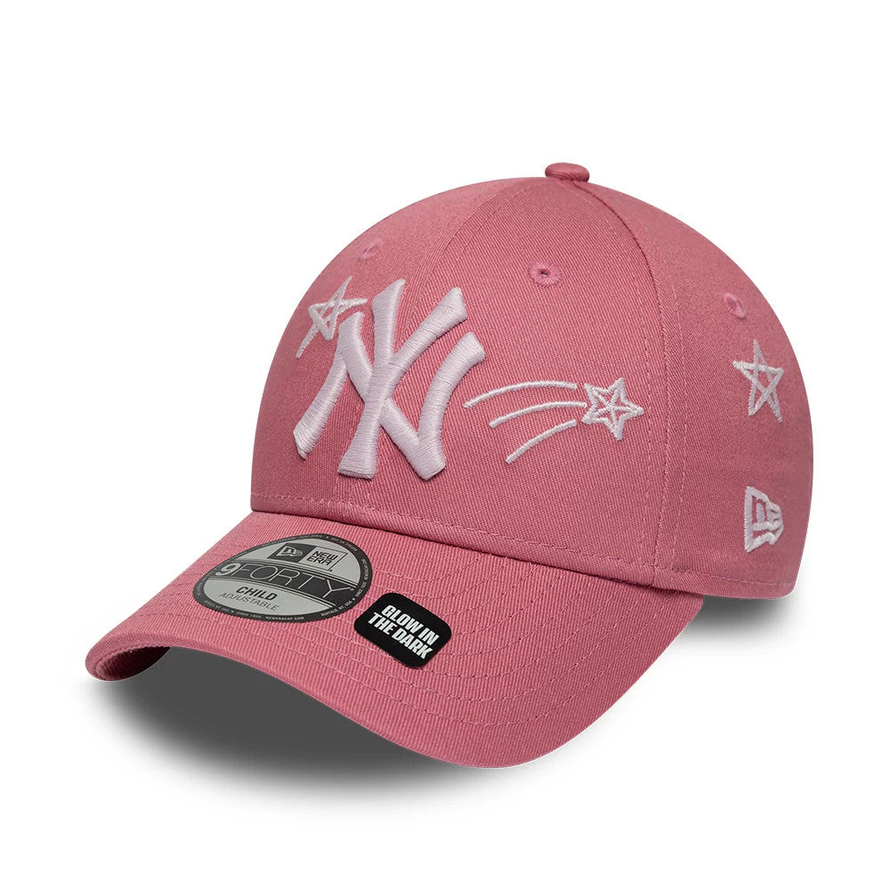 Yankees Child MLB Space Glow In The Dark Pink New Era 9FORTY Adjustable Cap, front view showing raised white embroidered NY logo on a pink crown with stars and comets, curved visor with a 9FORTY size sticker and Glow In The Dark sticker.