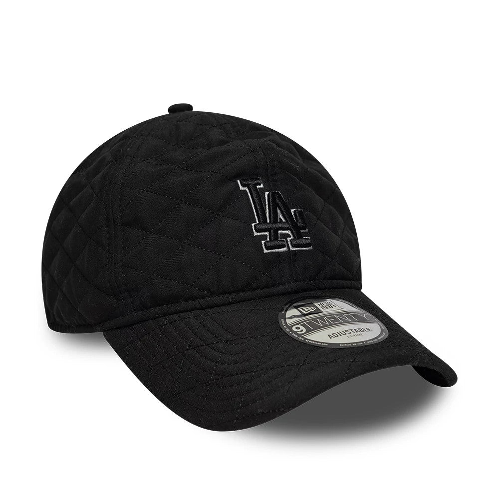 LA Dodgers MLB Padded Outline Black New Era 9TWENTY Adjustable Cap, front view showing the raised embroidered white LA logo on a quilted black crown, curved visor with stitching, and 9TWENTY size sticker on top.