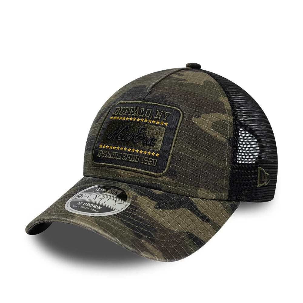 Pictured is this New Era Camo 9FORTY M-Crown A-Frame Trucker cap in dark green. 1