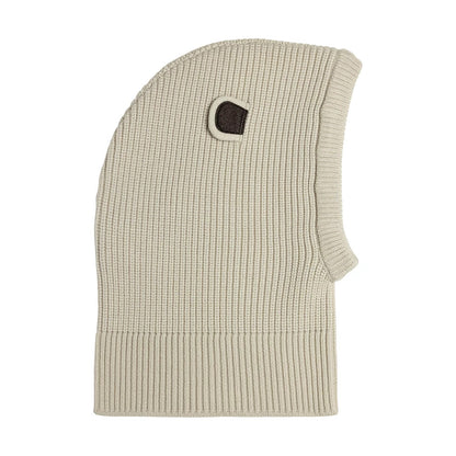 Child New Era Bear Light Beige Balaclava Hat, side view showing the ribbed knit texture and a small dark brown ear detail on the top side, with an extended ribbed band for added coverage and comfort.