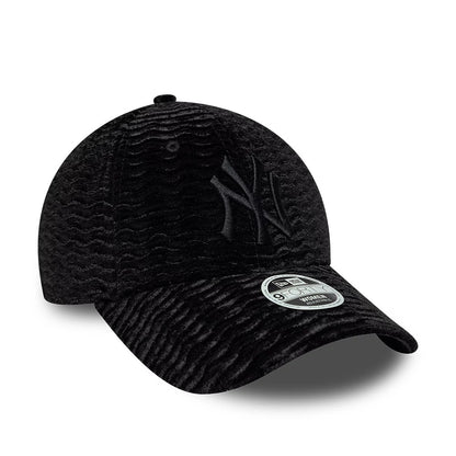 New York Yankees Womens MLB Velour Black New Era 9FORTY Adjustable Cap, three-quarter view showing the raised black embroidered NY logo on the front panel, curved black visor with a 9FORTY size sticker, and rich velour texture across the crown.
