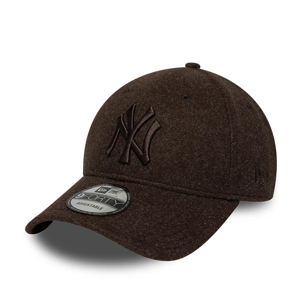 New York Yankees MLB Winter Brown New Era 9FORTY Adjustable Cap, front three-quarter view showing the dark brown raised embroidered Yankees logo on the structured crown, with a matching curved visor and a 9FORTY size sticker on the visor.
