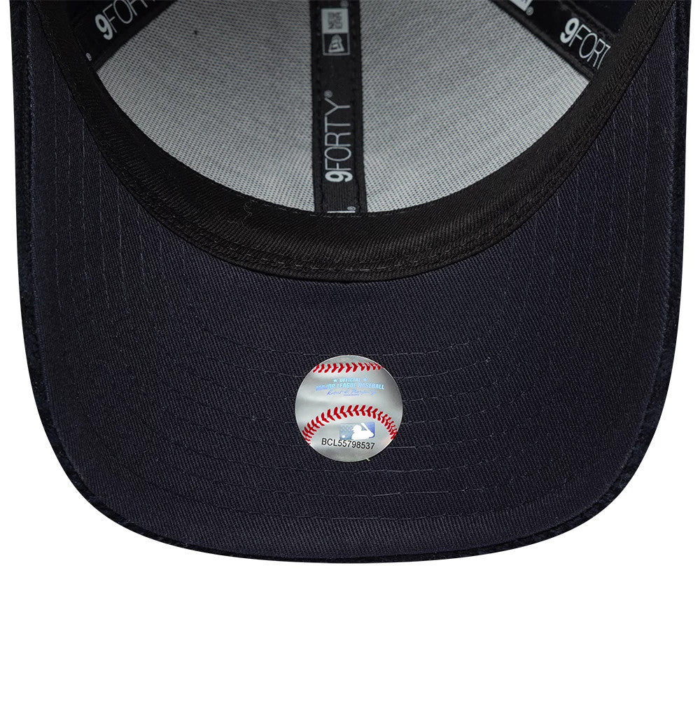 New York Yankees Youth MLB Cord Navy New Era 9FORTY M-Crown Adjustable Cap, inside view showing the black sweatband with 9FORTY branding, grey taping along the seams, and a round sticker with a baseball design on the navy undervisor.