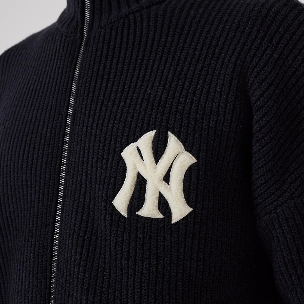 New Era New York Yankees MLB Navy 2 Way Zip Cardigan, front view showing the textured ribbed knit fabric, with the cream NY logo patch embroidered on the left chest, and a zipper running down the centre.