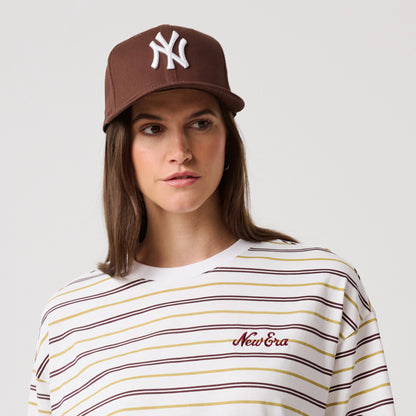 The model is wearing this New Era Stripe T-Shirt in white. 6