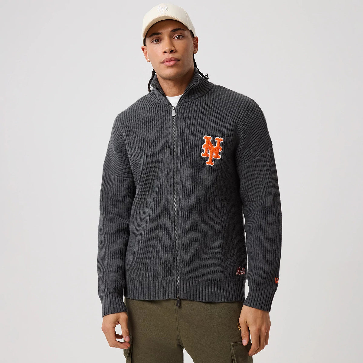 The model is wearing this MLB New York Mets 2 Way Zip Cardigan in charcoal. 3