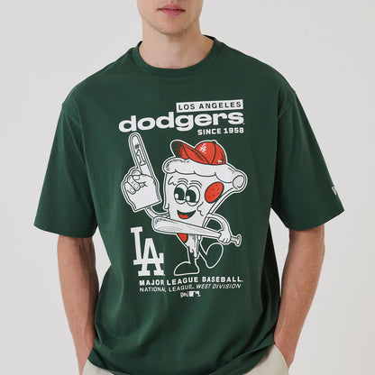 New Era LA Dodgers MLB Food Graphic Dark Green Oversized T-Shirt, front view on-model highlighting a large printed graphic of a cheerful slice of pizza with an LA baseball cap, sporting LA Dodgers and Major League Baseball text across the chest.