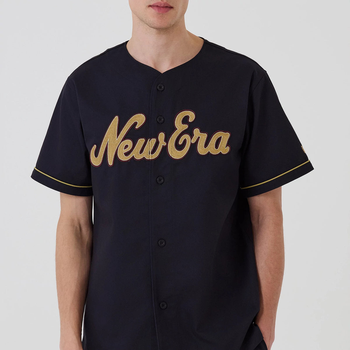 The model is wearing this New Era Straight Hem Jersey in navy. 3