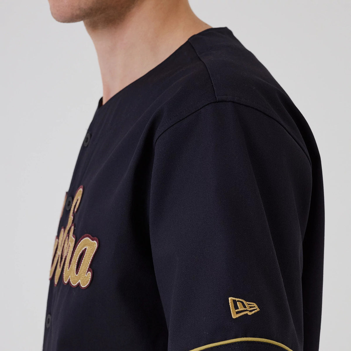 The model is wearing this New Era Straight Hem Jersey in navy. 5