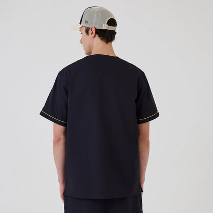 The model is wearing this New Era Straight Hem Jersey in navy. 2
