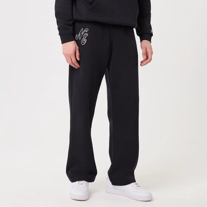 New Era Navy Straight Leg Joggers, front view on a model wearing a black hoodie and white trainers, featuring the embroidered NE logo on the left thigh, wide leg opening, and a relaxed fit.