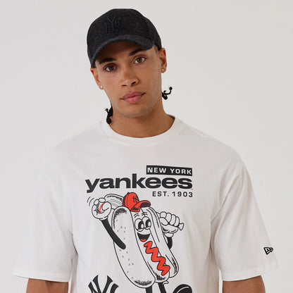 The model is wearing this MLB Hotdog Graphic New York Yankees Oversized T-Shirt in white. 5