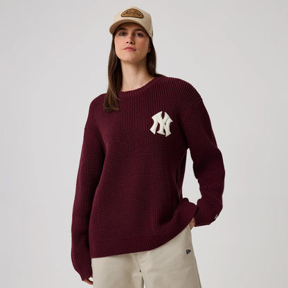 The model is wearing this MLB Waffle Knit New York Yankees Crew Neck Sweater in dark purple. 4