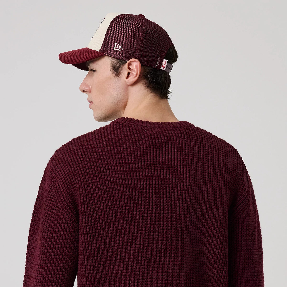 The model is wearing this MLB Waffle Knit New York Yankees Crew Neck Sweater in dark purple. 8