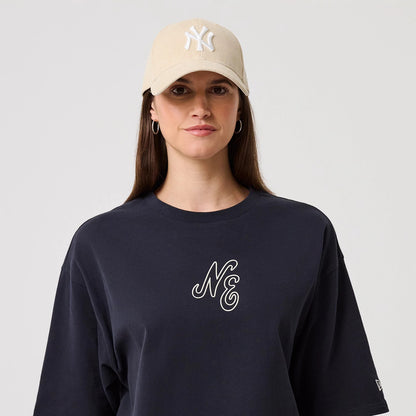 The model is wearing this New Era Crest Graphic Oversized T-Shirt in navy. 6