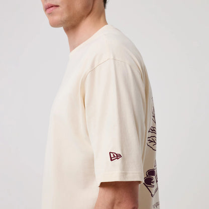 The model is wearing this New Era Crest Graphic Oversized T-Shirt in open white. 7
