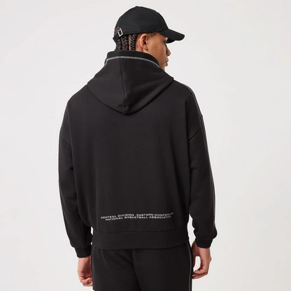 The model is wearing this NBA Graphic Chicago Bulls Pullover Hoodie in black. 2