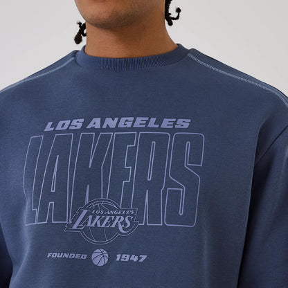 The model is wearing this NBA Graphic LA Lakers Crew Neck Sweater in dark blue. 3