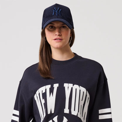 The model is wearing this MLB Arch Graphic New York Yankees Crew Neck Sweater in navy. 6