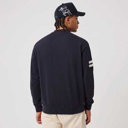 The model is wearing this MLB Arch Graphic New York Yankees Crew Neck Sweater in navy. 2