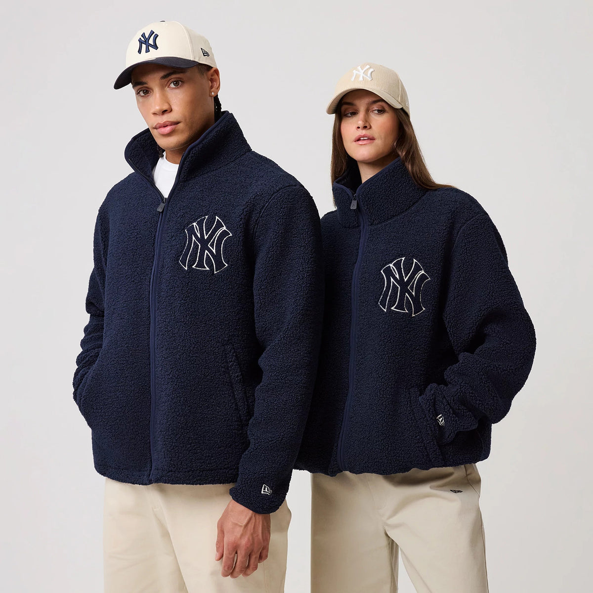 The model is wearing this MLB New York Yankees Sherpa Jacket in dark blue. 1
