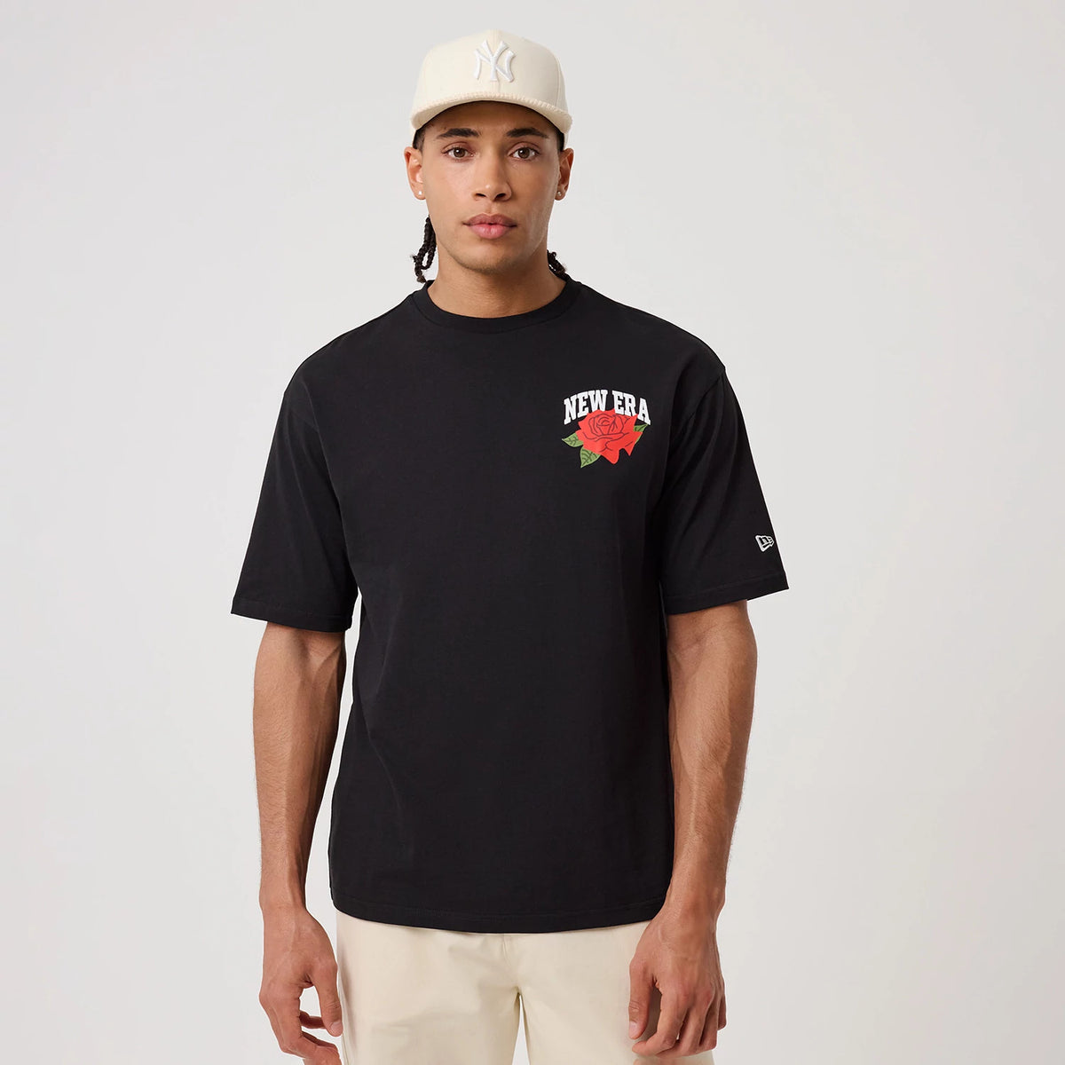 The model is wearing this New Era Floral Graphic T-Shirt in black. 3