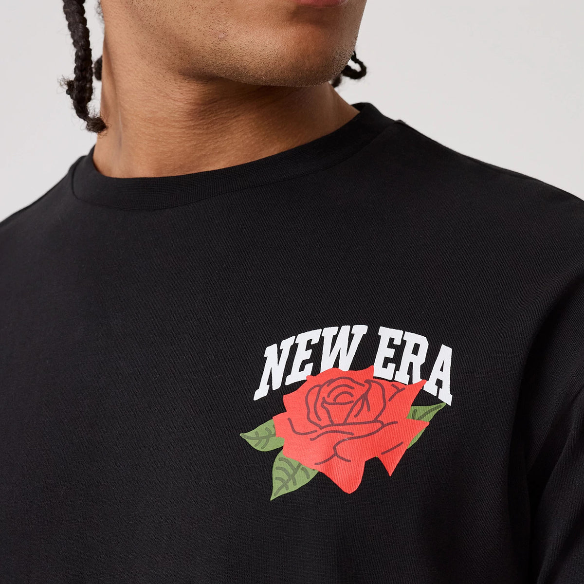 The model is wearing this New Era Floral Graphic T-Shirt in black. 5