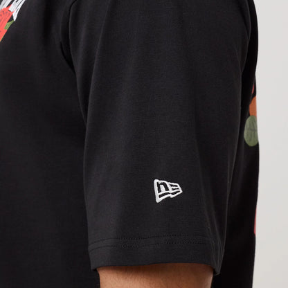 The model is wearing this New Era Floral Graphic T-Shirt in black. 7