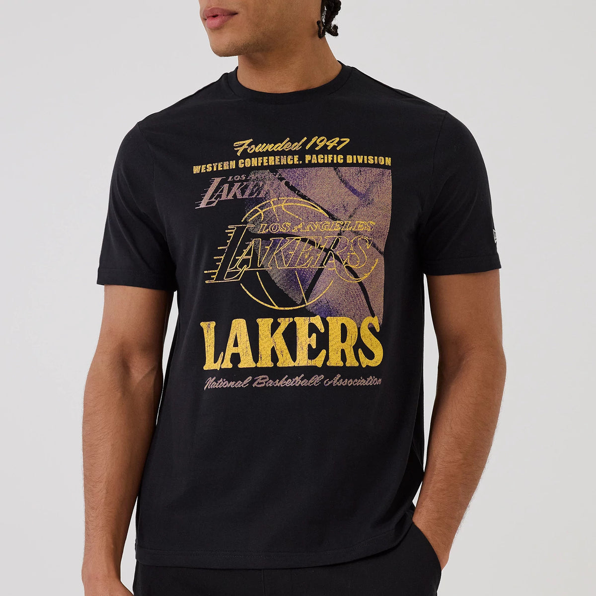 The model is wearing this NBA Graphic LA Lakers T-Shirt in black. 3